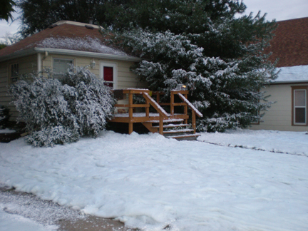 house lawn covered wiith fakle snow