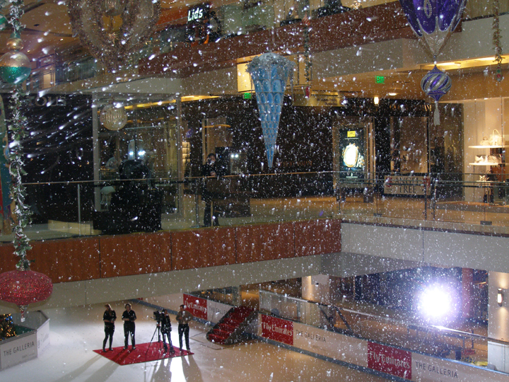 fake snow falling from T 1500 snowmachines at  a simon mall
